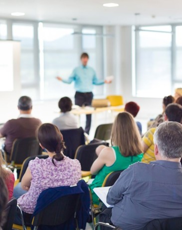 A speaker presenting at a webinar